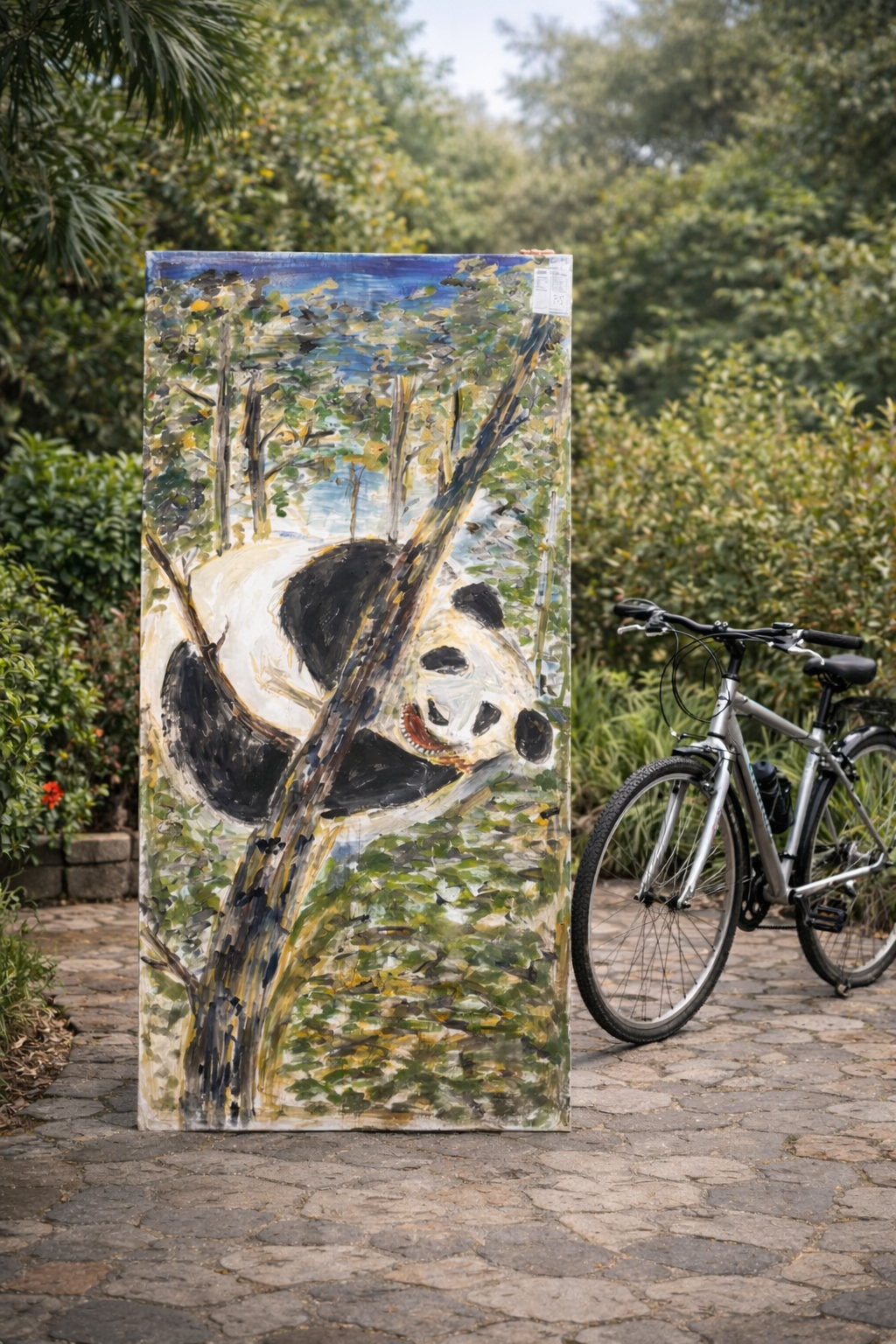Panda holding on a tree 